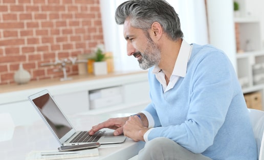 man working at a laptop