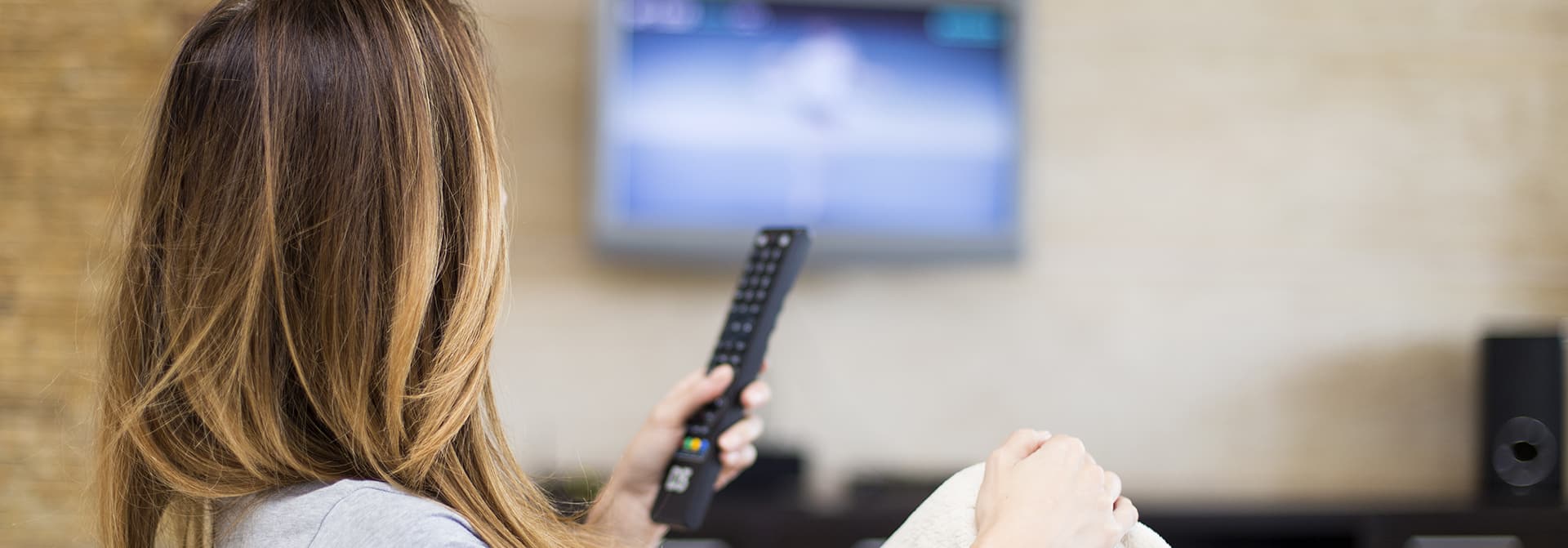 woman holding a remote